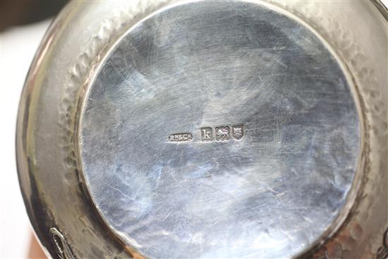 An Edwardian Arts & Crafts planished silver and enamel circular box and cover by Ramsden and Carr, height 11.5cm.